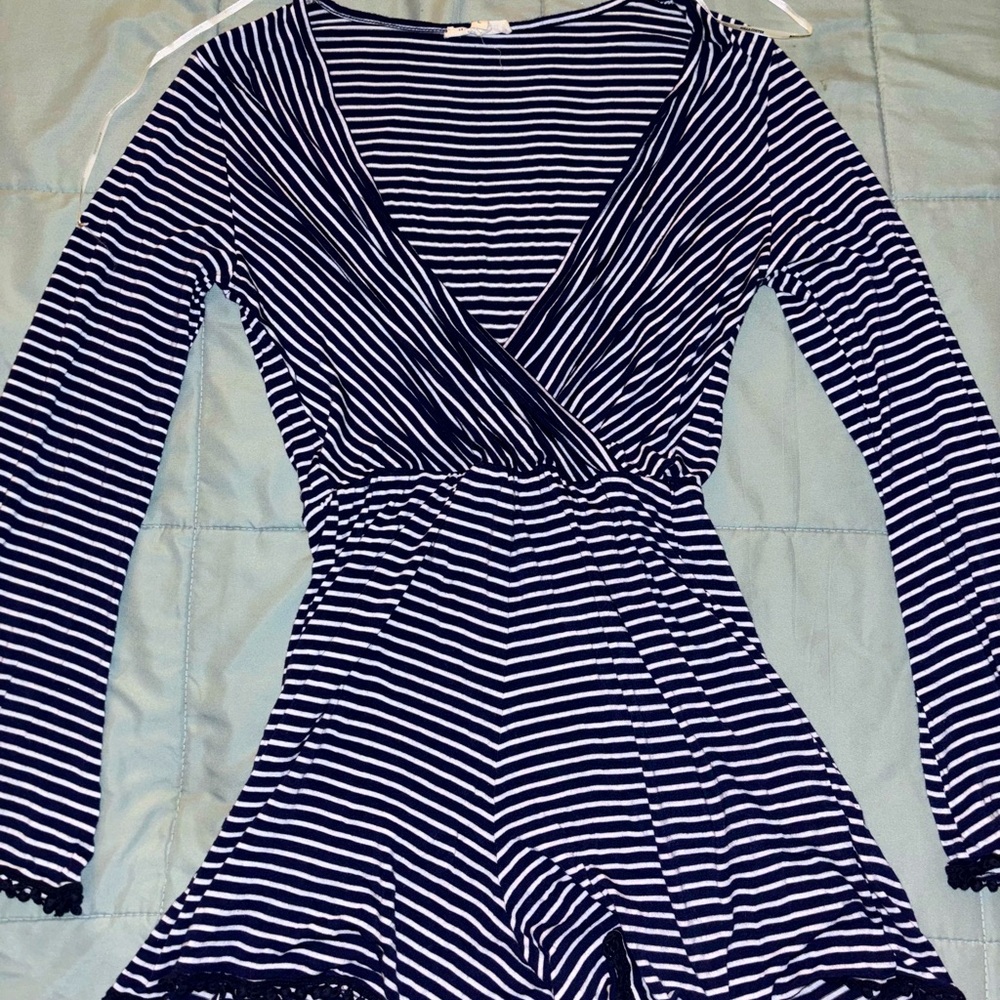 Navy and white striped romper with long sleeves and V-neck